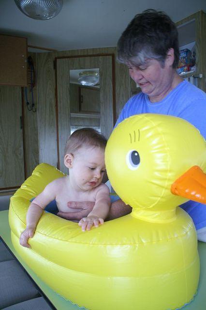 Grandma bathes the beach munchkin